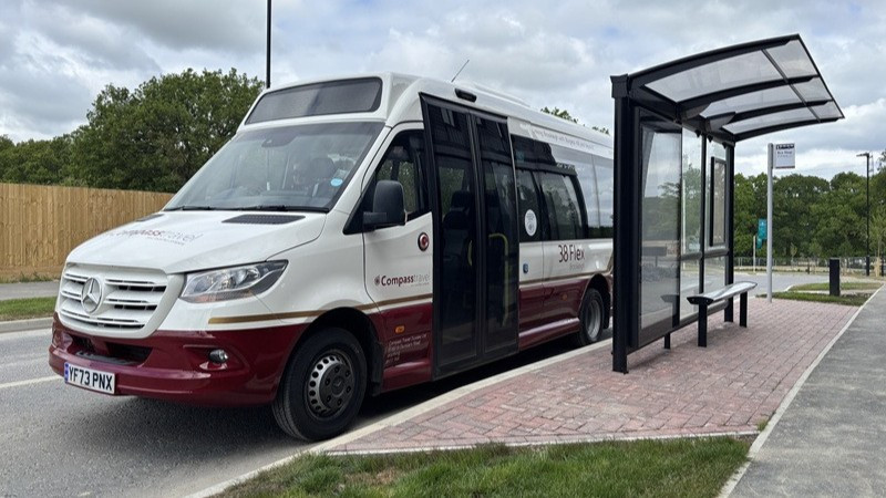 Compass Travel Bus and Logo